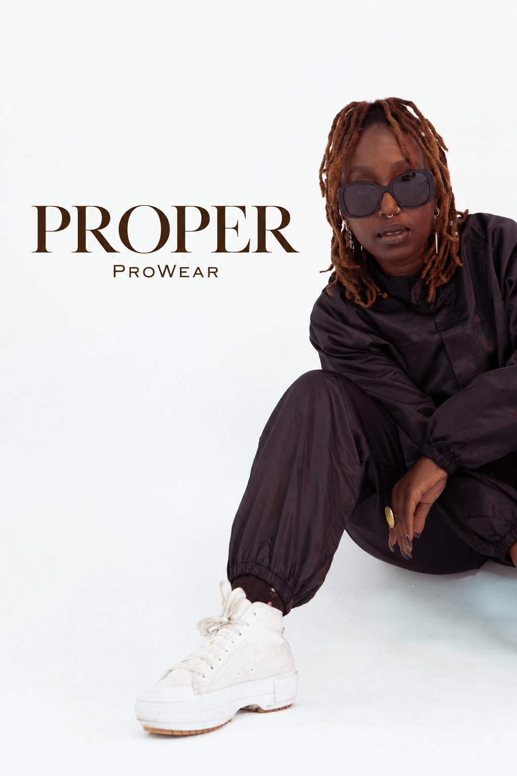 Stylist wearing Barber Armour hair-resistant jacket and trousers with cuffed ankles
